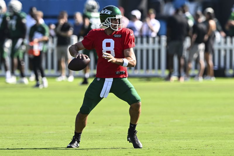 New York Jets quarterback Aaron Rodgers drops back to throw a pass during an NFL football joint practice with the Carolina Panthers Thursday, Aug. 15, 2024, in Charlotte, N.C. (AP Photo/Matt Kelley)