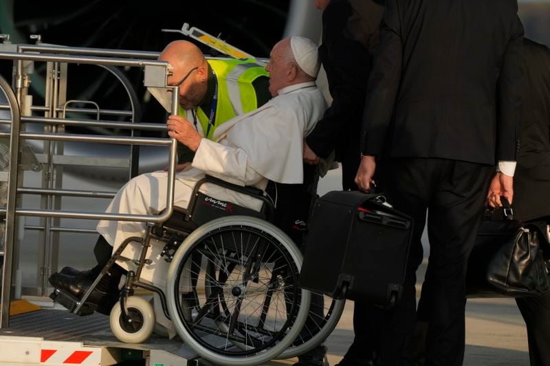 Pope Francis arrives at Fiumicino International airport Leonardo da Vinci, some 30 kilometers south-west of Rome, Thursday, Sept. 26, 2024 to board the papal flight to Luxembourg for a four-day visit to Luxembourg and Belgium. (AP Photo/Gregorio Borgia)