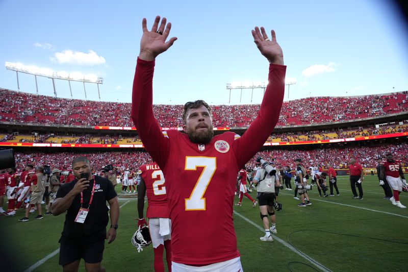 Kansas City Chiefs kicker Harrison Butker (7) walks off the field after kicking a 51-yard field goal at the end of an NFL football game against the Cincinnati Bengals to give the Chiefs a 26-25 victory Sunday, Sept. 15, 2024, in Kansas City, Mo. (AP Photo/Charlie Riedel)