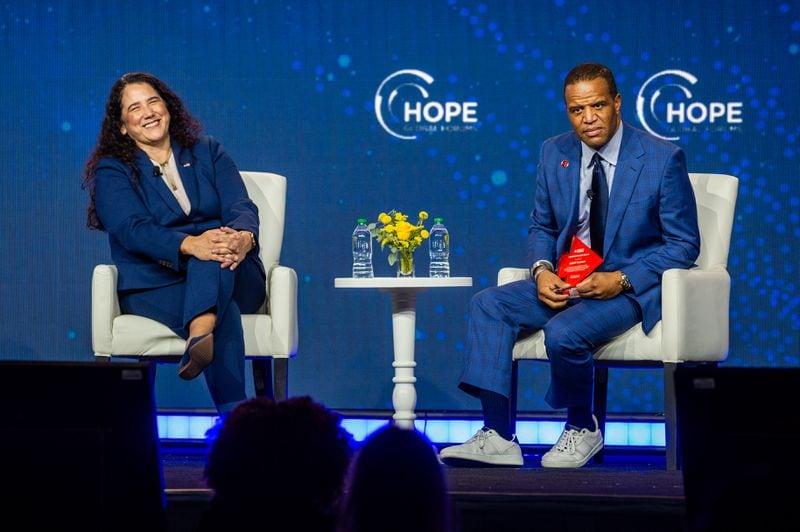 ATLANTA, Georgia 231211 — From left, SBA Administrator Isabel Guzman and Operation HOPE Founder and CEO John Hope at the HOPE Global Forum held at the Hyatt Regency in downtown Atlanta on Monday, December 11, 2023. Mr. Bryant speaks. Atlanta Journal Constitution)