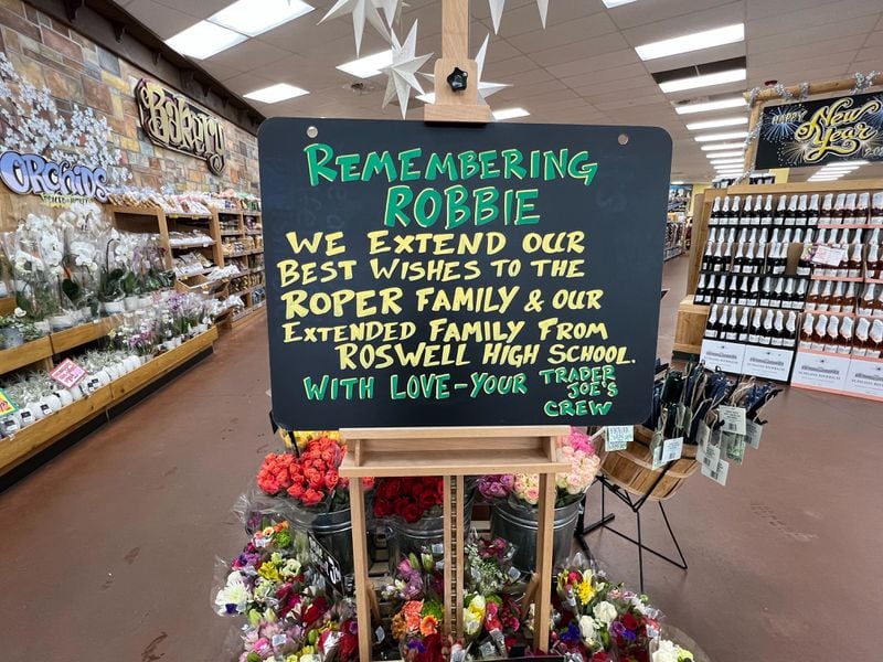 The Trader Joe's store on Roswell Road in East Cobb had memorial inside Wednesday honoring Robbie Roper.