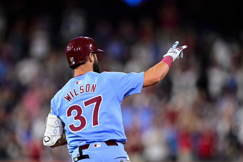 Philadelphia Phillies' Weston Wilson gestures after hitting a solo home run off Washington Nationals' Tanner Rainey during the seventh inning of a baseball game, Thursday, Aug. 15, 2024, in Philadelphia. (AP Photo/Derik Hamilton)