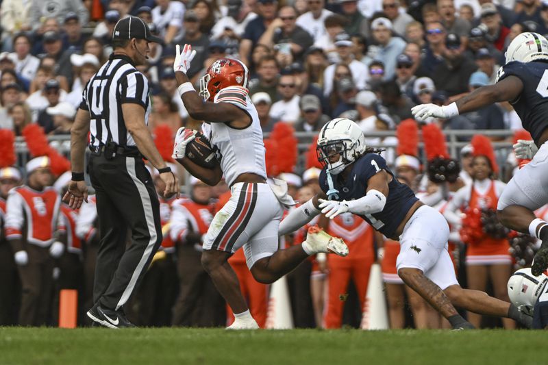 Bowling Green running back Jamal Johnson (6) breaks away from Penn State safety Jaylen Reed (1) to score a touchdown during the second quarter of an NCAA college football game, Saturday, Sept. 7, 2024, in State College, Pa. (AP Photo/Barry Reeger)