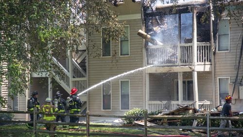 Sandy Springs firefighters worked to control a blazing fire at Azalea Park apartment complex in June. Everyone made it out safe and unharmed. (Katelyn Myrick/katelyn.myrick@ajc.com)