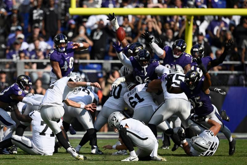 Las Vegas Raiders place kicker Daniel Carlson (2) kicks a field goal against the Baltimore Ravens during the second half of an NFL football game, Sunday, Sept. 15, 2024, in Baltimore. (AP Photo/Nick Wass)