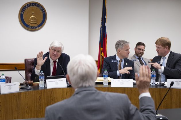 Sen. Bill Cowsert (R-Athens), chairman of the Senate Select Committee on Investigations, swears in David Cook, the former secretary of the Senate, during a meeting of the committee Friday, Sept. 13, 2024, at the State Capitol.   Ben Gray for the Atlanta Journal-Constitution