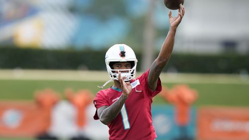 Miami Dolphins quarterback Tua Tagovailoa (1) does drills during NFL football training camp, Wednesday, July 24, 2024, in Miami Gardens, Fla. (AP Photo/Lynne Sladky)