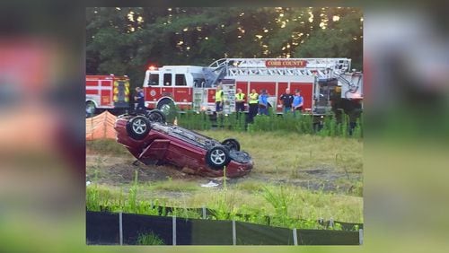 A car crashed into a retention pond Thursday, killing the driver. (Credit: Channel 2 Action News)