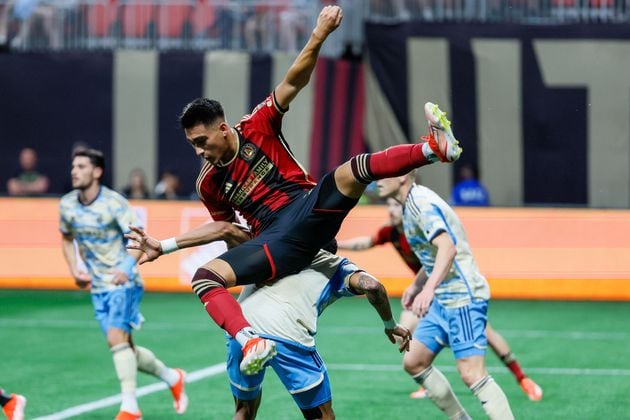 Atlanta United forward Tyler Wolff (28) landed on Philadelphia Union defender Damion Lowe (17) on a play by the box during the first half against the Philadelphia Union on Sunday, April 14, 2024.
 Miguel Martinez / miguel.martinezjimenez@ajc.com