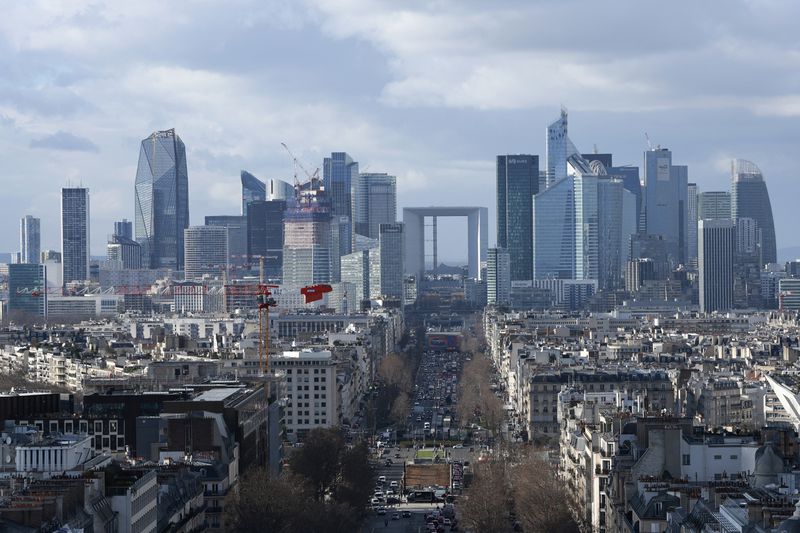 FILE - La Defense business district is pictured from the top of the Arc de Triomphe, Monday, Feb. 12, 2024 in Paris. From taxing billionaires and making gasoline cheaper to earlier retirement and higher wages, opposing left-right blocs in France's election are making costly campaign promises that are spooking investors as they seek to woo voters and sideline President Emmanuel Macron. (AP Photo/Aurelien Morissard, File)
