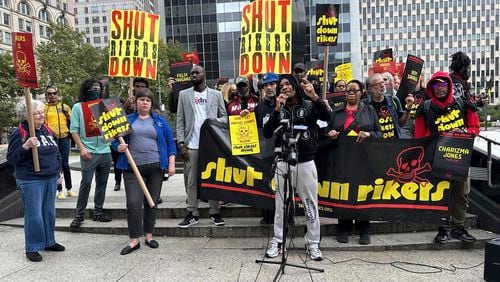 People hold a rally against Rikers Island jail complex outside Manhattan Criminal Court on Wednesday, Sept. 25, 2024 in New York. (AP Photo/Philip Marcelo)