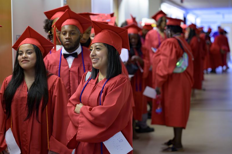 Graduates line up for their high school equivalency (HiSET) diplomas at a graduation ceremony for the Youth Empowerment Project (YEP), a non-profit organization which received money from the NBA Foundation program in New Orleans, Thursday, June 27, 2024. (AP Photo/Matthew Hinton)