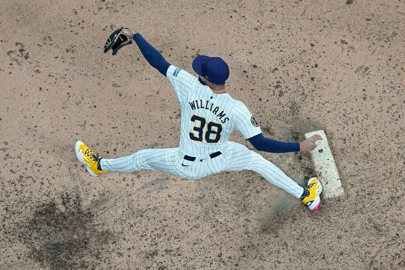 Milwaukee Brewers' Devin Williams throws during the ninth inning of Game 3 of a National League wild card baseball game against the New York Mets Thursday, Oct. 3, 2024, in Milwaukee. (AP Photo/Morry Gash)