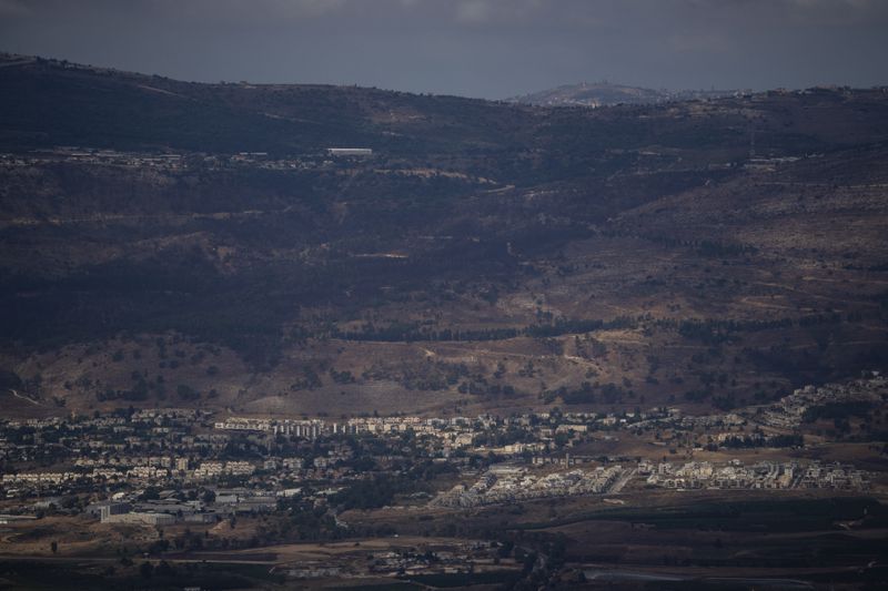 Buildings are seen in Kiryat Shmona, a city located next to the border with Lebanon, as seen from the Israeli-annexed Golan Heights, Tuesday, Sept. 17, 2024. (AP Photo/Leo Correa)