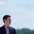 Sen. Jon Ossoff, D-Ga., waiting on the tarmac to greet Vice President Kamala Harris at Dobbins Air Reserve Base in Marietta, Ga. (AP Photo/Brynn Anderson)