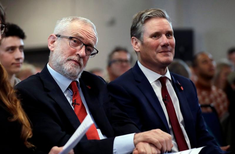 FILE - Britain's opposition Labour party leader Jeremy Corbyn, left, sits waiting to speak next to Keir Starmer Labour's Shadow Secretary of State for Exiting the European Union during their election campaign event on Brexit in Harlow, England, Tuesday, Nov. 5, 2019. Britain goes to the polls on Dec. 12. (AP Photo/Matt Dunham, File)