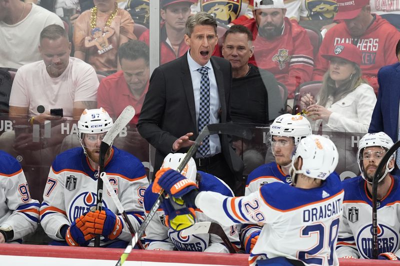 Edmonton Oilers head coach Kris Knoblauch gestures during the second period of Game 5 of the NHL hockey Stanley Cup Finals against the Florida Panthers, Tuesday, June 18, 2024, in Sunrise, Fla. (AP Photo/Rebecca Blackwell)