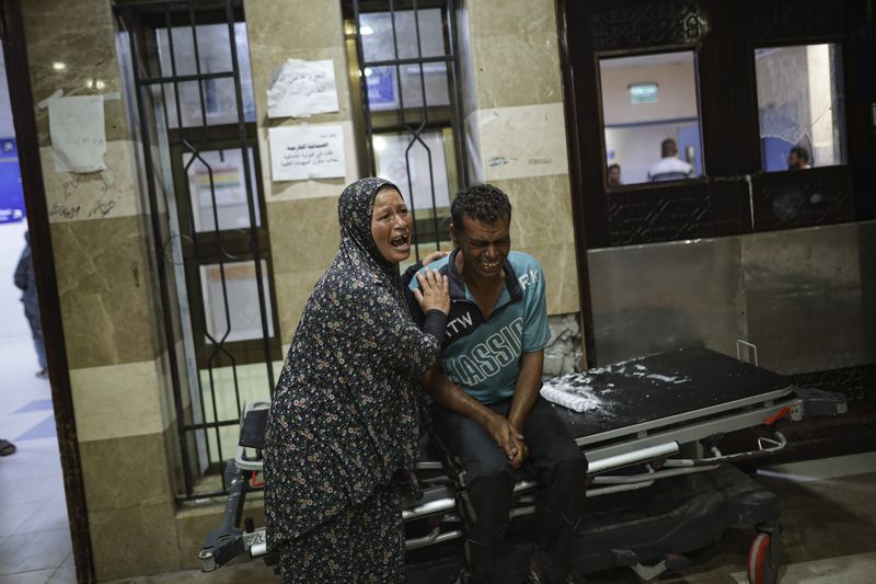 Palestinians react after their relative was killed in Israeli bombardment of the Gaza Strip at a hospital in Khan Younis, Thursday, June. 27, 2024. (AP Photo/Jehad Alshrafi)