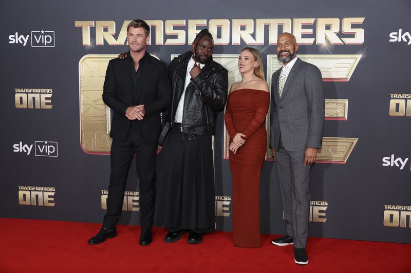 Chris Hemsworth, from left, Brian Tyree Henry, Scarlett Johansson and Keegan-Michael Key pose for photographers upon arrival at the premiere for the film 'Transformers One' on Thursday, Sept. 19, 2024 in London. (Photo by Vianney Le Caer/Invision/AP)