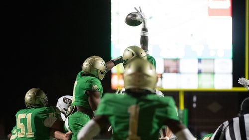 Buford blocks a field goal at the Buford/Mill Creek football game(Photo Jamie Spaar for The Atlanta Journal-Constitution)