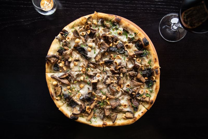 Tre Vele Pizza Vegano with wild mushrooms, hazelnuts, vegan cheese, and black truffle cashew cream. (Mia Yakel for The Atlanta Journal-Constitution)