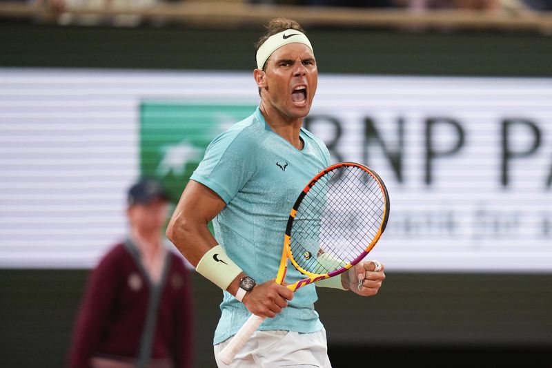 Spain's Rafael Nadal clenches his fist after scoring a point against Germany's Alexander Zverev during their first round match of the French Open tennis tournament at the Roland Garros stadium in Paris, Monday, May 27, 2024. (AP Photo/Thibault Camus)