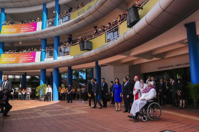 Pope Francis attends an interreligious meeting with young people at the Catholic Junior College in Singapore, Friday, Sept. 13, 2024. In Singapore, his final stop of an 11-day trip to Asia and Oceania, Francis once again ditched his remarks when he arrived at the last event, a meeting of Singaporean youth on Friday morning. "That's the talk I prepared," he said, pointing to his speech and then launching into a spontaneous back-and-forth with the young people about the need to have courage and take risks. (AP Photo/Gregorio Borgia)