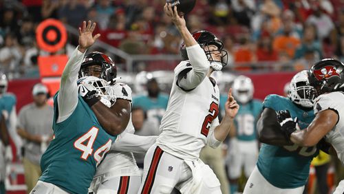 Tampa Bay Buccaneers quarterback Kyle Trask (2) aims a pass during the first half of a pre season NFL football game against the Miami Dolphins, Friday, Aug. 23, 2024, in Tampa, Fla. (AP Photo/Jason Behnken)