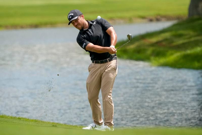 Xander Schauffele chips onto the 18th green during the second round of the St. Jude Championship golf tournament Friday, Aug. 16, 2024, in Memphis, Tenn. (AP Photo/Mark Humphrey)