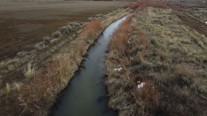 An irrigation canal is shown in Owyhee, Nev., March 13, 2024, on the Duck Valley Indian Reservation that straddles the Nevada-Idaho border. (AP Photo/Rick Bowmer)