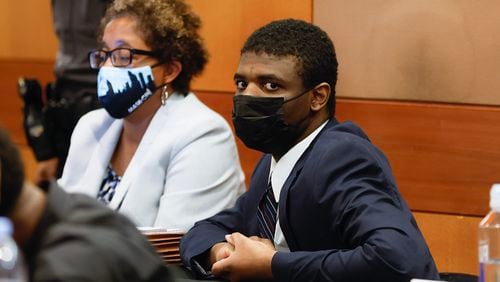 Jayden Myrick, a defendant in YSL/Young Thug trial and his attorney Gina Bernard sit in court for jury selection on Wednesday, January 4, 2023.  (Natrice Miller/natrice.miller@ajc.com)