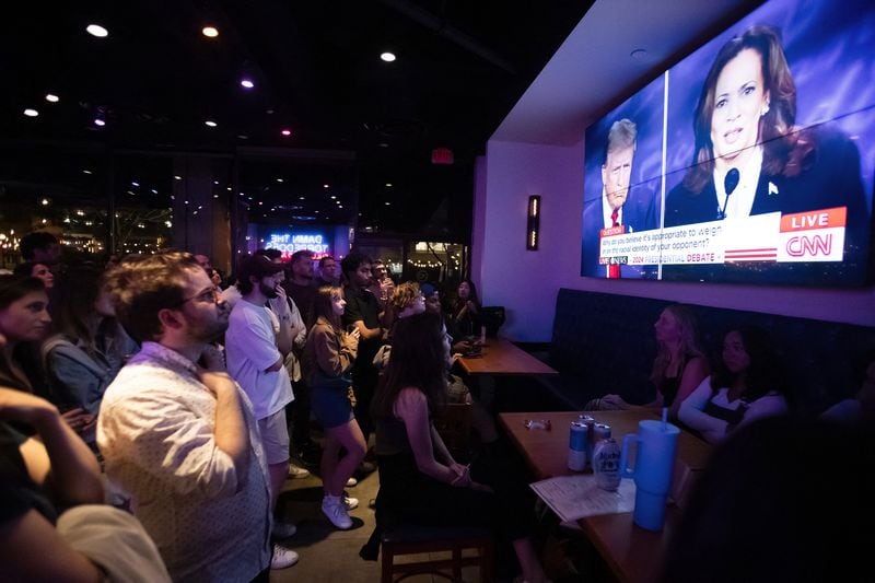 People attend a watch party earlier this month for the U.S. presidential debate between Democratic presidential candidate Kamala Harris and the Republican nominee, Donald Trump. Harris has challenged Trump to return to Atlanta on Oct. 23 for a second showdown in Atlanta on Oct. 23. So far, he has declined. (Allison Bailey/AFP/Getty Images/TNS)