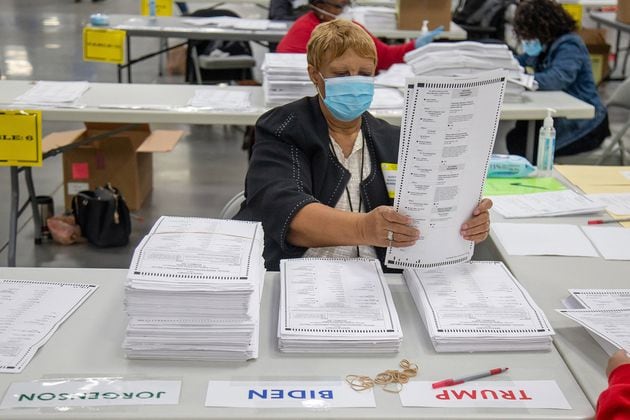 Election workers in DeKalb County, Georgia, sort presidential ballots on Nov. 14, 2020. (Steve Schaefer/Atlanta Journal-Constitution)