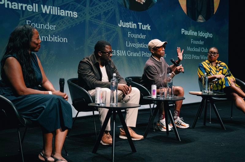 Discussion at the 2024 Black Ambition Paris Demo Day, featuring Pharrell Williams (second from the right), founder of Black Ambition; Felecia Hatcher (right), CEO of Black Ambition and past winners of Black Ambition prizes.

CREDIT:  Jean-Bernard Matugas