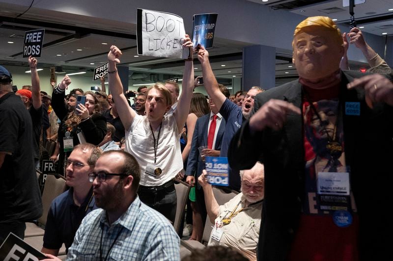 Libertarian delegates jeer Republican presidential candidate, former President Donald Trump as he speaks at the Libertarian National Convention at the Washington Hilton in Washington, Saturday, May 25, 2024. (AP Photo/Jose Luis Magana)