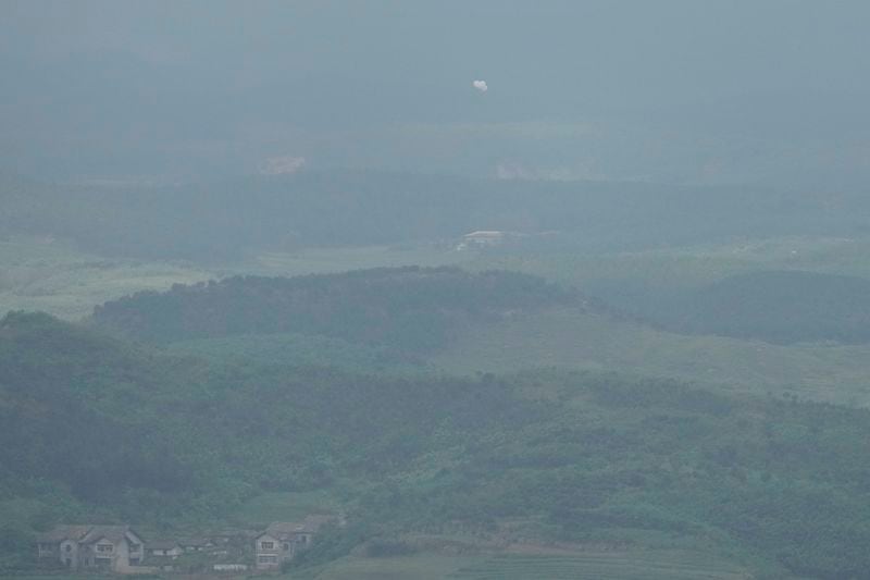 Balloons are seen from the Unification Observation Post in Paju, South Korea, near the border with North Korea, Thursday, Sept. 5, 2024. (AP Photo/Lee Jin-man)