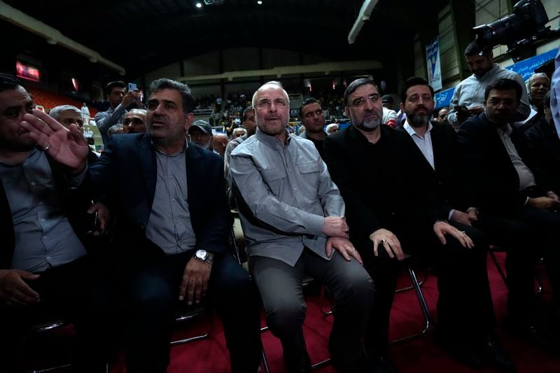 Mohammad Bagher Qalibaf, center, the most prominent candidate for the June 28, presidential election, who is Iran's parliament speaker, sits, during his campaign rally in Tehran, Iran, Tuesday, June 18, 2024. (AP Photo/Vahid Salemi)