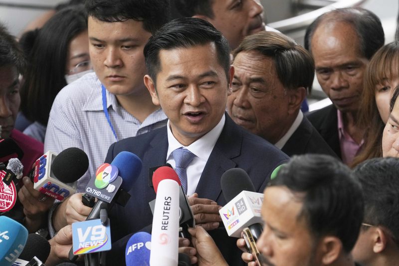 Former Thai Prime Minister Thaksin Shinawatra's lawyer Winyat Chatmontree talks to reporter at Criminal Court in Bangkok, Thailand, Tuesday, June 18, 2024. Thaksin has been granted release on bail hours after he was formally indicted on a charge of defaming the country's monarchy in one of several court cases that have unsteadied Thai politics. (AP Photo/Sakchai Lalit)
