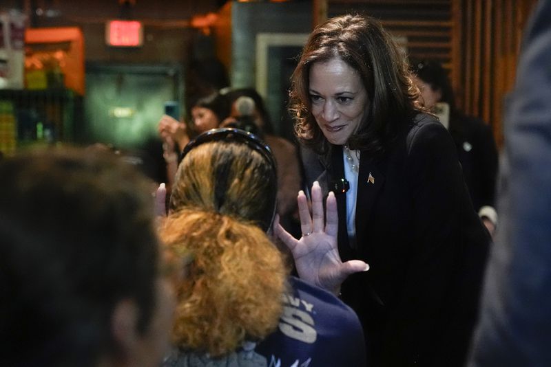 Democratic presidential nominee Vice President Kamala Harris talks as she visits SandFly Bar-B-Q in Savannah, Ga., Wednesday, Aug. 28, 2024. (AP Photo/Jacquelyn Martin)