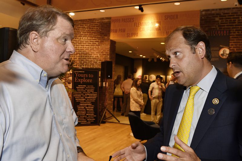 Eric Gregory, President of the Kentucky Distillers' Association, left, speaks with Rep. Andy Barr, R-Ky., before a gathering to celebrate the 25th anniversary of the Kentucky Bourbon Trail at the Frazier History Museum in Louisville, Ky., Thursday, June 20, 2024. (AP Photo/Timothy D. Easley)
