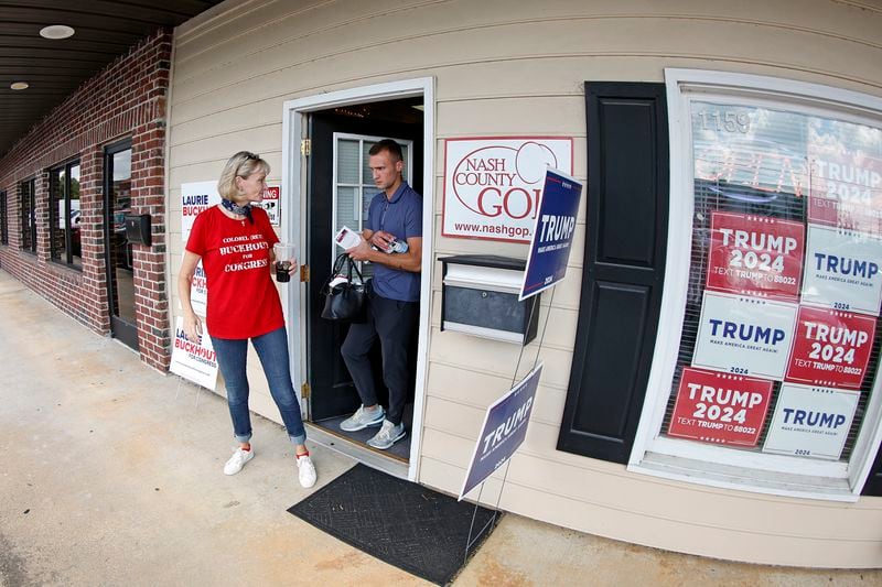 Congressional candidate Laurie Buckhout, R-N.C., left, leaves with a staff member from the Nash County Republican headquarters for a day of campaigning in Rocky Mount, N.C., Friday, Sept. 20, 2024. (AP Photo/Karl B DeBlaker)