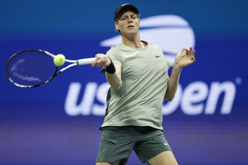 Jannik Sinner, of Italy, returns a shot to Tommy Paul, of the United States, during a fourth round match of the U.S. Open tennis championships, Monday, Sept. 2, 2024, in New York. (AP Photo/Adam Hunger)