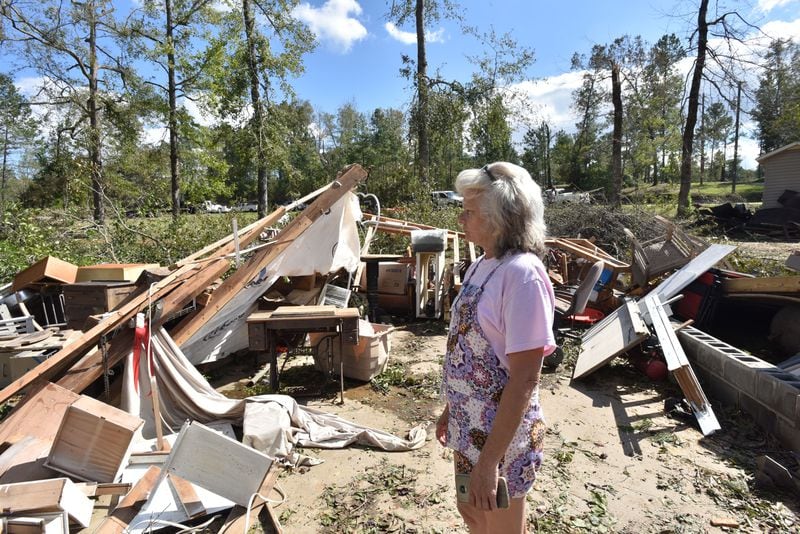 October 11, 2018 Roberta - Sharon Granade stands on destroyed two-car garage after Tropical Storm Michael  passed on Flint River Estates Road in Roberta on Thursday, October 11, 2018. Tropical Storm Michael swept out of Georgia before sunrise, leaving a trail of destruction in its wake. HYOSUB SHIN / HSHIN@AJC.COM