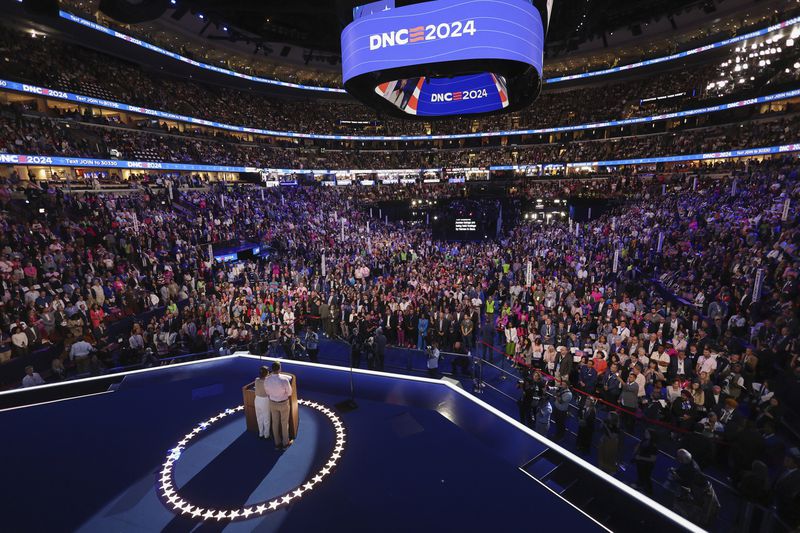 Jon Polin and Rachel Goldberg, parents of Hersh Goldberg-Polin who is being held hostage in Gaza, appear on stage on the third day of the Democratic National Convention in Chicago,Wednesday, Aug. 21, 2024. (Mike Segar/Pool via AP)