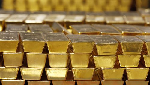 FILE - Gold bars are shown stacked in a vault at the United States Mint, on July 22, 2014, in West Point, N.Y. (AP Photo/Mike Groll, File)