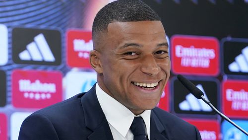 Kylian Mbappe, of France, smiles during a news conference after being presented to fans as a new Real Madrid player at the Santiago Bernabeu stadium in Madrid, Tuesday, July 16, 2024. (AP Photo/Andrea Comas)