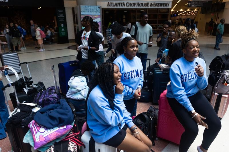 (From left) Janae Batum, 17, Khiara Wilson, 17, and Kennedy Watson, 16, all from Houston, wait with their luggage along with others to catch their flight on Wednesday, June 28, 2023, at Hartsfield-Jackson Atlanta International Airport. The high school students were traveling for a college visit to Spelman College. (Michael Blackshire/Michael.blackshire@ajc.com)