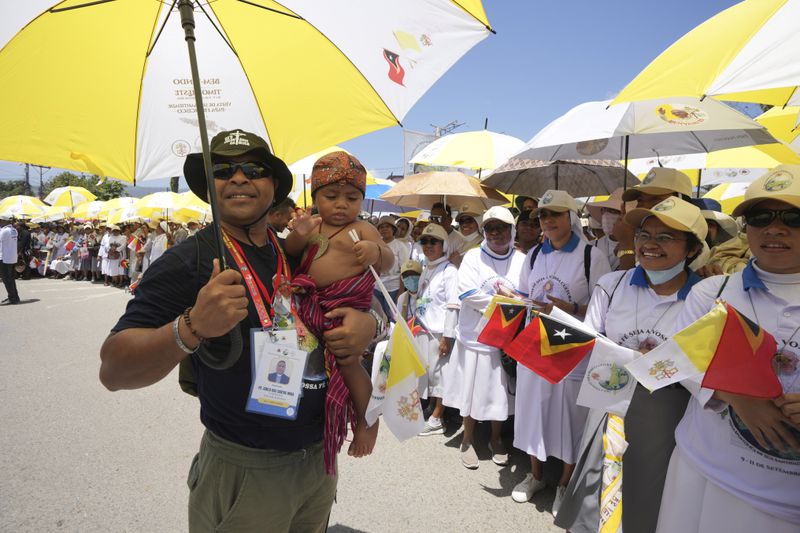 Nuns wait Pope Francis' arrival outside of the Dili Presidente Nicolau Lobato International Airport in Dili, East Timor, Monday, Sept. 9, 2024. (AP Photo/Firdia Lisnawati)