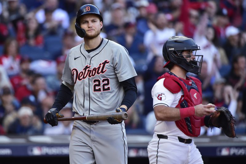 Detroit Tigers' Parker Meadows (22) walks back to the dugout after striking out in the fourth inning during Game 2 of baseball's AL Division Series against the Cleveland Guardians, Monday, Oct. 7, 2024, in Cleveland. Guardians catcher Austin Hedges is at right. (AP Photo/Phil Long)