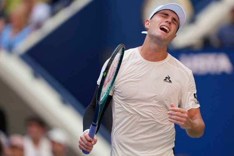 Christopher O'Connell, of Australia, reacts after losing a point to Jannik Sinner, of Italy, during the third round of the U.S. Open tennis championships, Saturday, Aug. 31, 2024, in New York. (AP Photo/Julia Nikhinson)